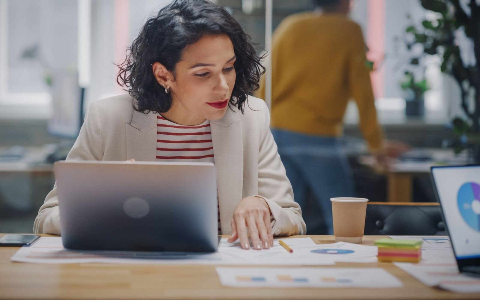 International business manager working at her desk
