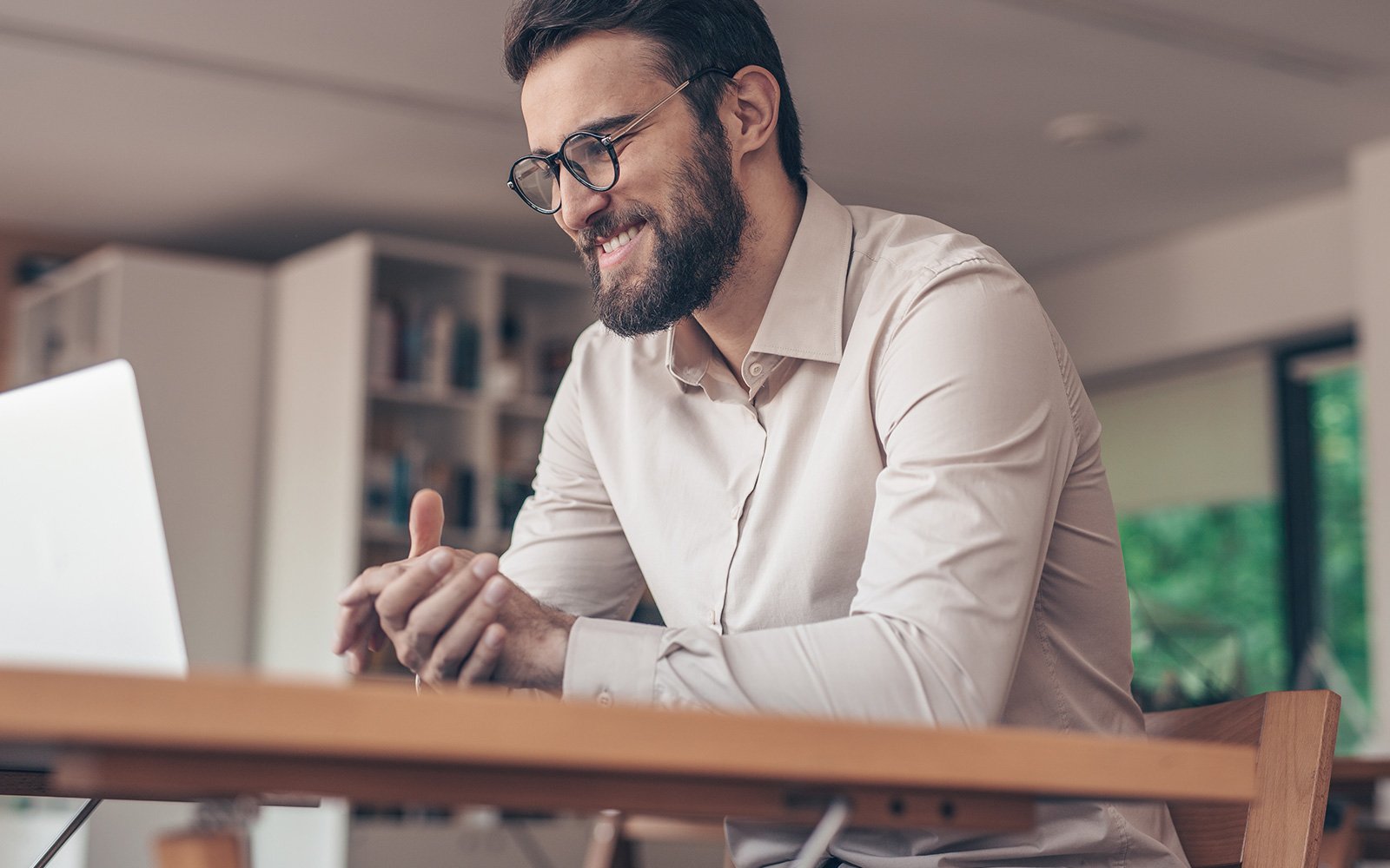 Man on laptop in online meeting