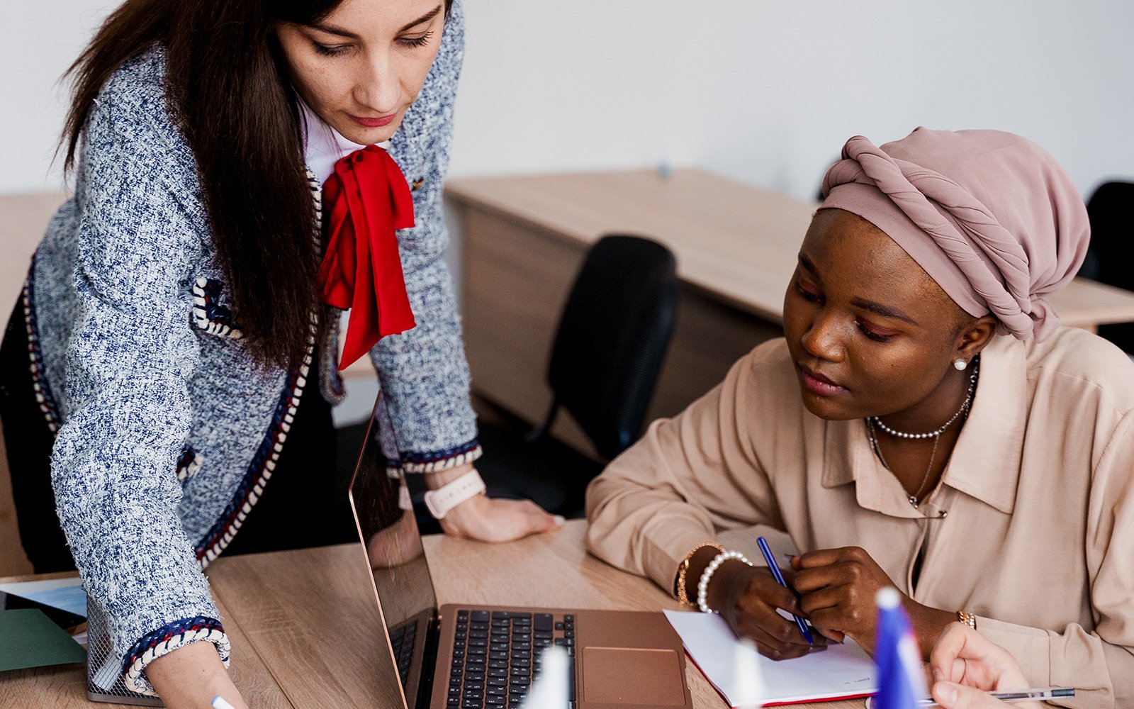 teacher working with a student