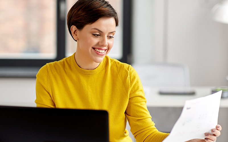 Business woman at her desk talking on the phone