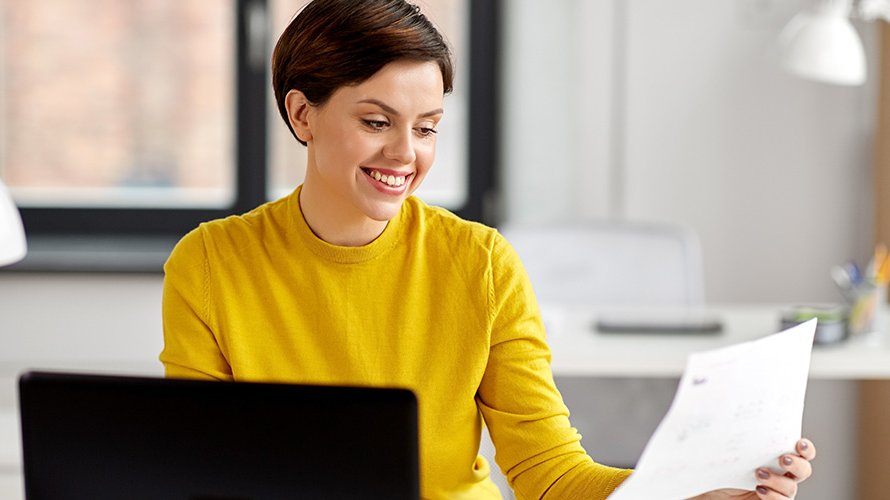 Business woman at her desk talking on the phone