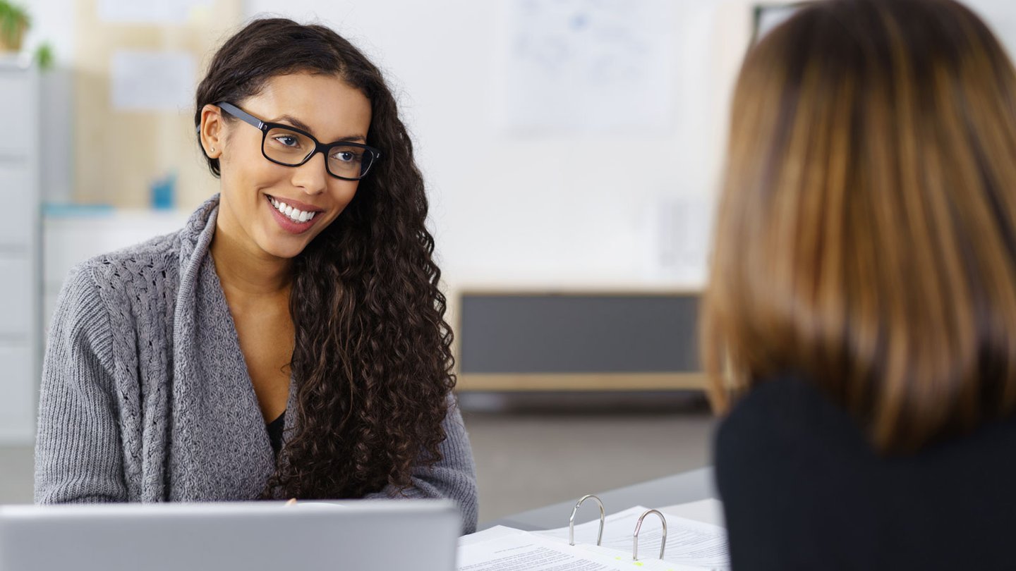 Woman working on her laptop at desk