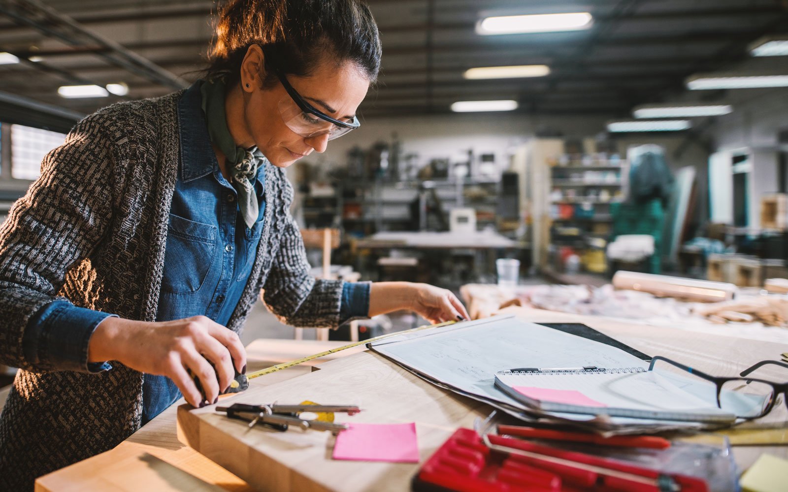 Woman in a workshop building construction model