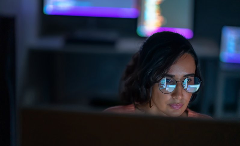 Woman performing legal research at computer.