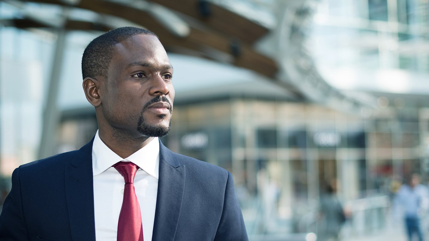 Man in suit standing in front of court