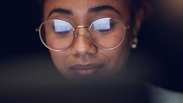 Woman with glasses using computer
