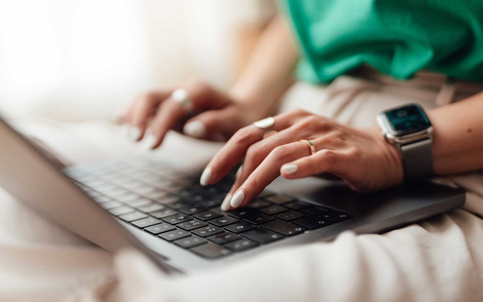 Woman typing on laptop