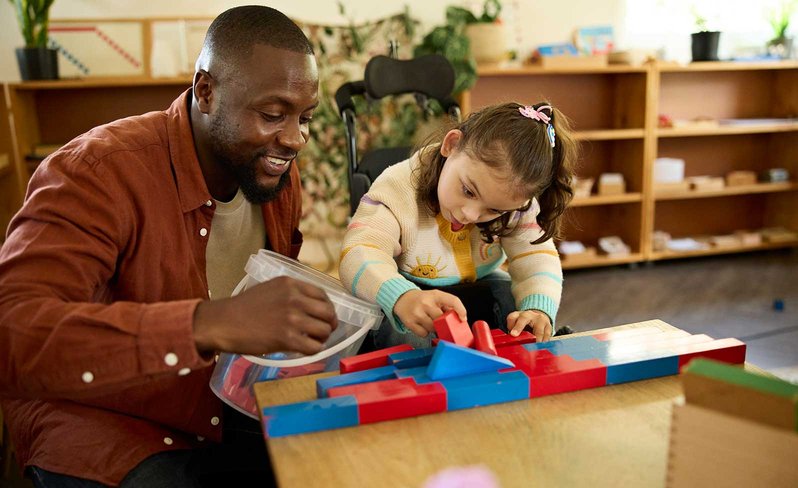 Teacher helping student with puzzle