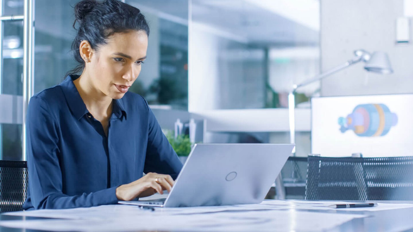 Professional woman typing on laptop