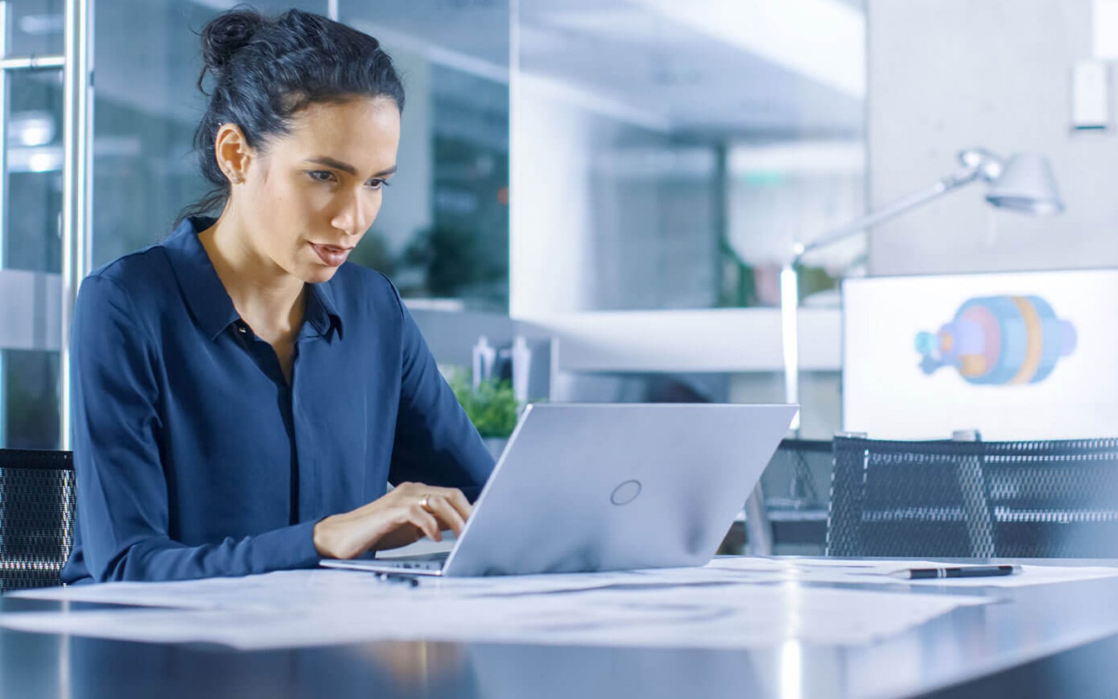 Professional woman typing on laptop