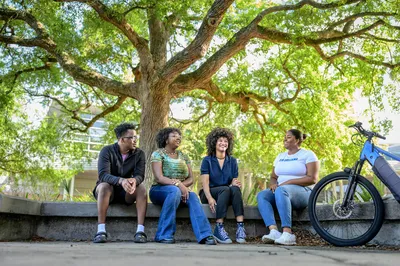 LSU New Orleans students chat on campus