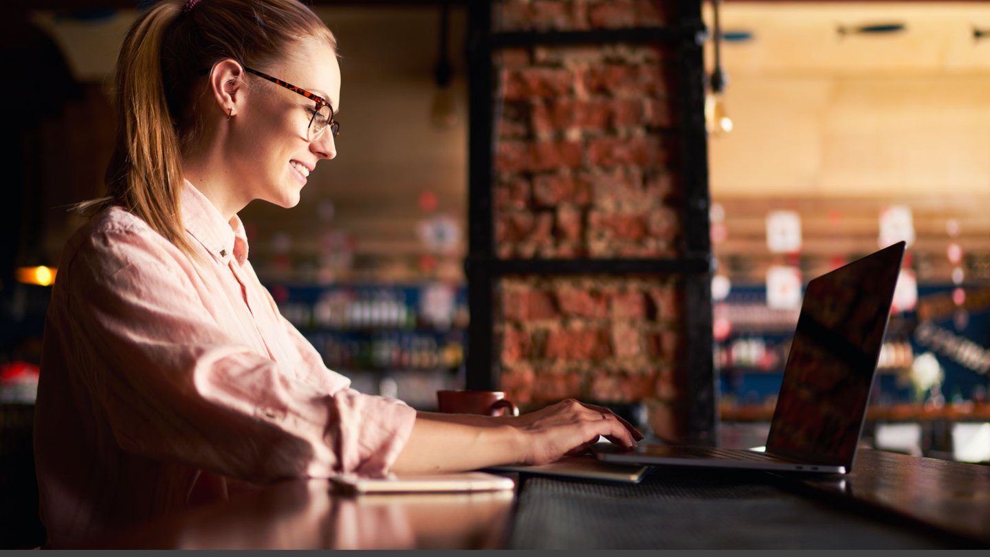 woman doing work on her laptop
