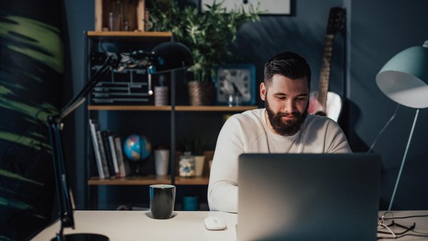 Man on laptop at his home office