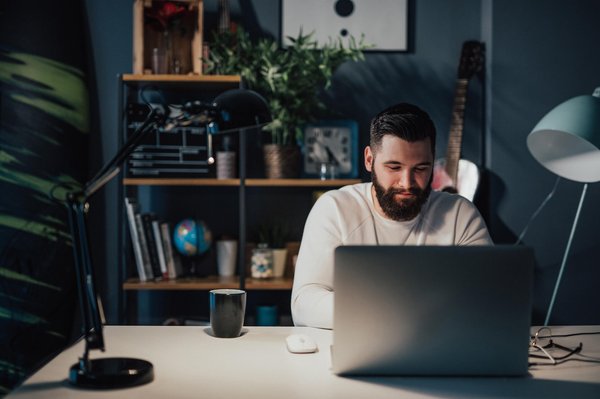 Man on laptop at his home office