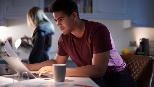 Man studying in kitchen