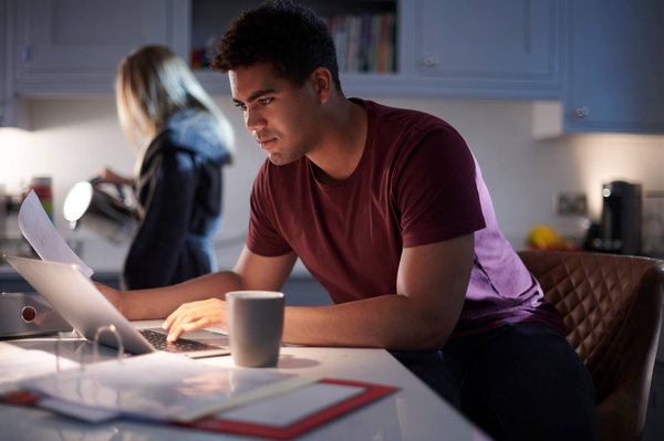 Man studying in kitchen