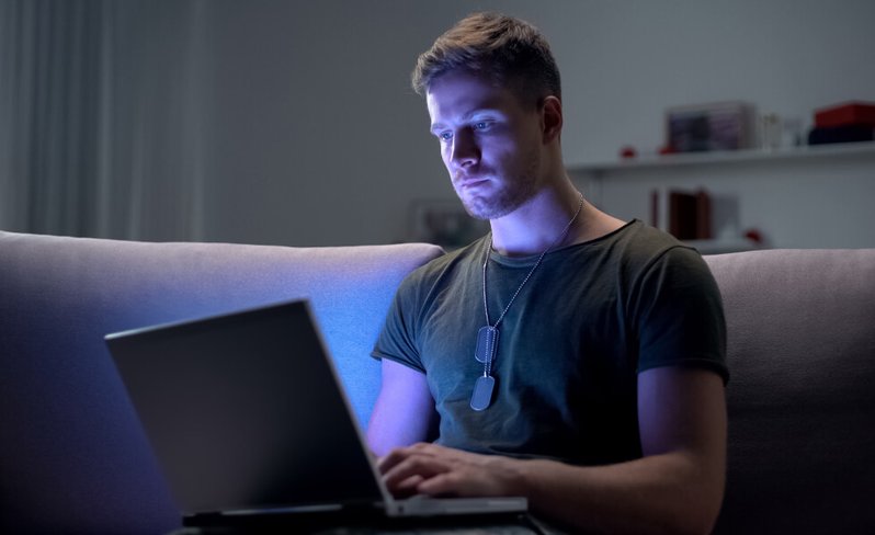 Military online student using laptop