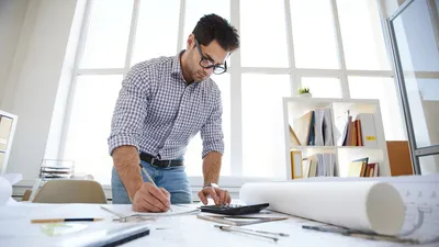 Project manager reviews construction budget.