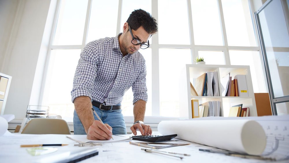 Project manager reviews construction budget.