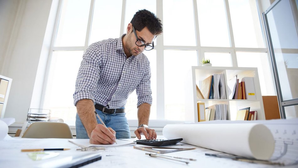 Project manager reviews construction budget.