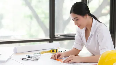 A civil engineers working on plans