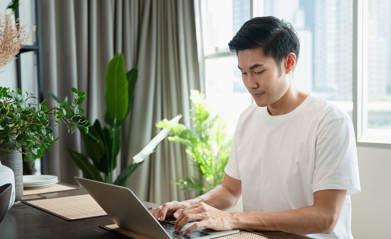 Male healthcare student on laptop