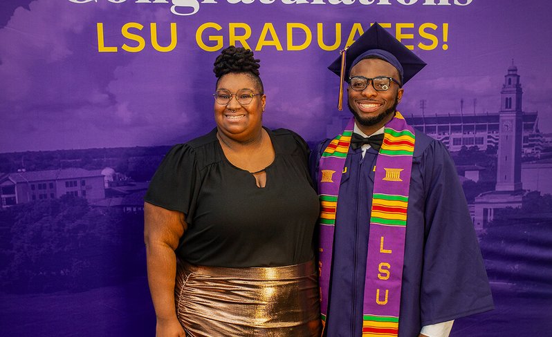 LSU Online student support coach and student at graduation