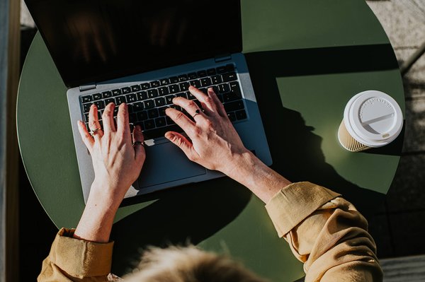 Taking notes on laptop