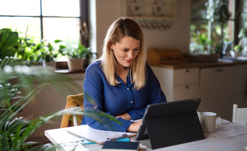 Woman learning on tablet