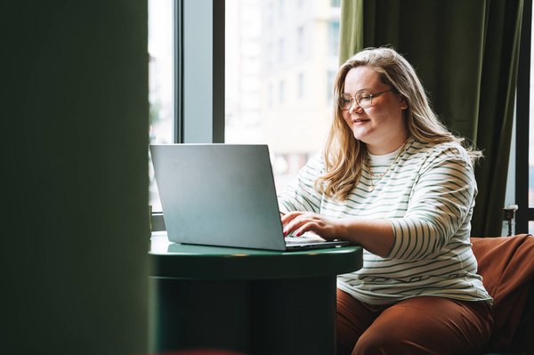 Woman on laptop at coffee shop