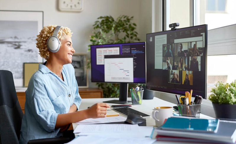 Woman with headphones on laptop
