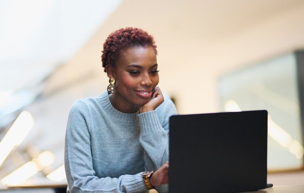 Woman using laptop at desk