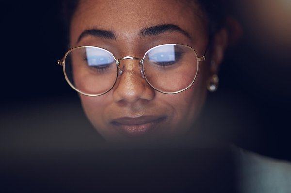 Woman looking at laptop screen