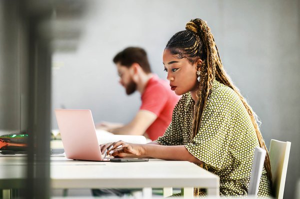 Woman on laptop at library